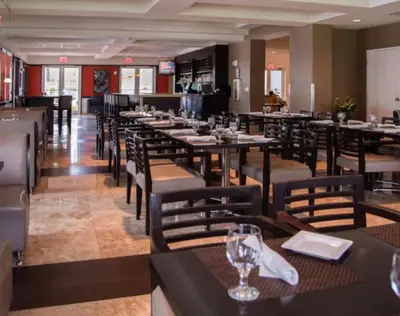a dining room with tables and chairs in a restaurant at Doral 2-Story Villa 3 Bed 4 Bath at Provident Doral at The Blue Miami in Miami