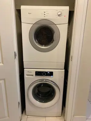a washer and dryer in a small room at Doral 2-Story Villa 3 Bed 4 Bath at Provident Doral at The Blue Miami in Miami