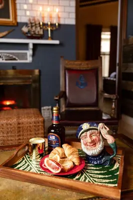 a tray of food with bread and a bottle of sauce at The Captain's Landing - 4 bedroom - 2 bathroom - Outdoor soaking tub - Adventure home in Fort Lauderdale