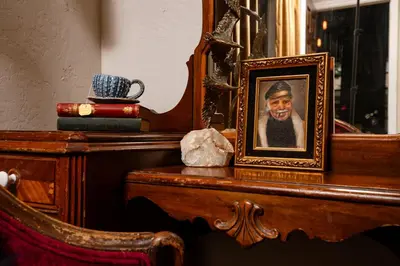 a picture of a man on a table in front of a mirror at The Captain's Landing - 4 bedroom - 2 bathroom - Outdoor soaking tub - Adventure home in Fort Lauderdale