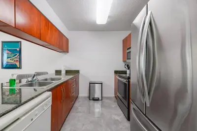a kitchen with a stainless steel refrigerator at Spectacular apartment in Heart of Brickell in Miami