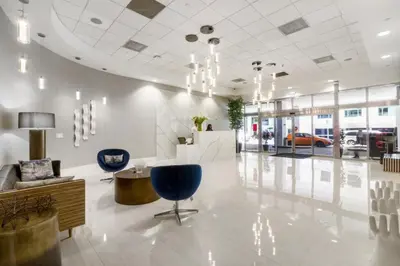 a lobby with two blue chairs and a table at High Rise Brickell Modern Studio in Miami