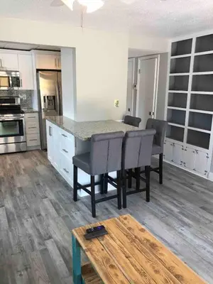 a kitchen with a table and chairs in a room at The Tel in Hollywood