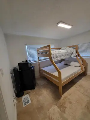 a small room with a bunk bed and a television at 1161 Studio 3 Miami in Miami