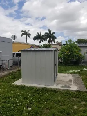 a white shed in a yard with palm trees at 1161 Studio 3 Miami in Miami