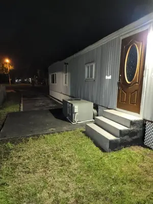 a front door of a house with a television outside at 1161 Studio 3 Miami in Miami