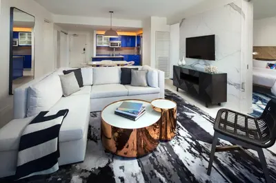 a living room with a white couch and a table at W Fort Lauderdale in Fort Lauderdale