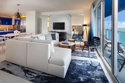a living room with a white couch and a table at W Fort Lauderdale in Fort Lauderdale