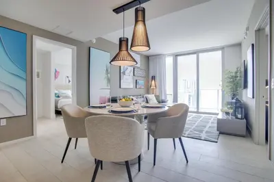 a dining room with a table and chairs at Upscale Condo with Pool Access in Hyde Beach House! in Hollywood