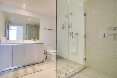 a bathroom with a shower and a sink and a toilet at Upscale Condo with Pool Access in Hyde Beach House! in Hollywood