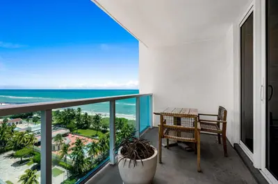 a balcony with a table and a view of the ocean at Oceanview Private Condo at 1 Hotel & Homes -1115 in Miami Beach