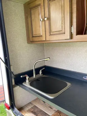 a kitchen sink in the back of a van at Cozy Camper - Free Parking in Miami