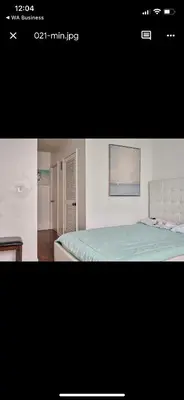 a picture of a bedroom with a bed and a painting at Apartments TVG Miami by the ocean ! in Miami Beach