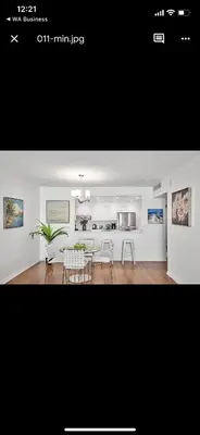 a kitchen and dining room with a table and chairs at Apartments TVG Miami by the ocean ! in Miami Beach