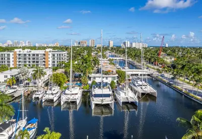 a group of boats docked at a marina at Isle of Venice Residence and Marina in Fort Lauderdale