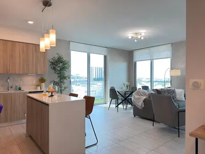 a kitchen and living room with a couch and a table at Desing district, great apartment in Miami