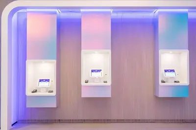 a bathroom with two urinals with purple and purple walls at YOTELPAD Miami in Miami