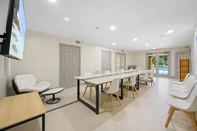 a conference room with a long table and chairs at Yacht Club at aventura Amazing Marina view parking included in Miami