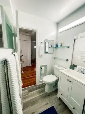 a bathroom with a toilet and a sink at Hammocks & mini-golf! 10 mins from Beach! in Hollywood
