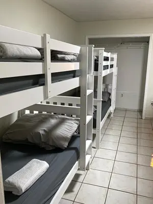 two sets of bunk beds in a room at Single Size BOTTOM Bunk Bed - Mixed Shared ROOM in Miami