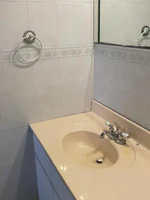 a bathroom with a sink and a mirror at Single Size TOP Bunk Bed - Mixed Shared ROOM in Miami