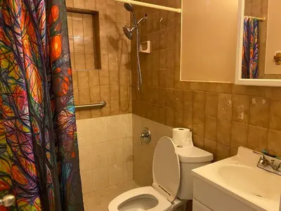 a bathroom with a toilet and a sink at Single Size TOP Bunk Bed - Mixed Shared ROOM in Miami