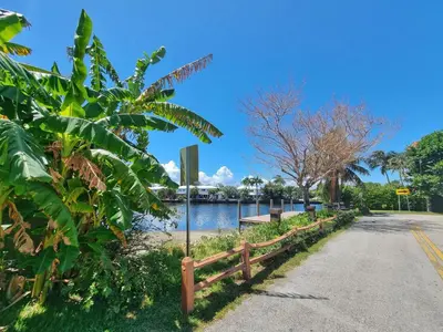 a path next to a body of water at Surf House - Paddleboards - Canoes -1 mile to Wilton Manors in Fort Lauderdale