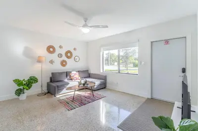a living room with a couch and a table at Renovated Apts with Kitchen, Fast WiFi, Smart TV, Roku & Pool Onsite 4 mi to Surfside Beach in North Miami