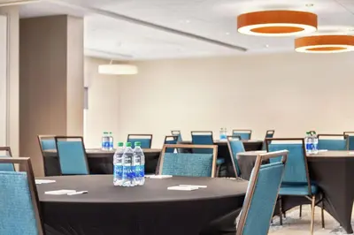 a conference room with a table with bottles of water on it at Hampton Inn & Suites Miami, Kendall, Executive Airport in Kendall