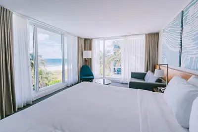 a hotel room with a bed and a large window at B Ocean Resort Fort Lauderdale Beach in Fort Lauderdale