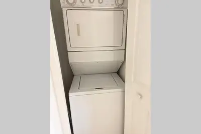 a white washer and dryer in a small kitchen at Comfortable 2 BR at Brickell , Free Parking in Miami
