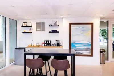 a kitchen with a table and two chairs at Comfortable 2 BR at Brickell , Free Parking in Miami