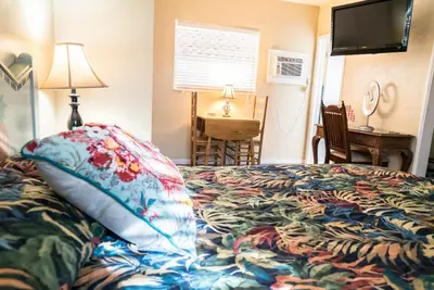 a bedroom with a bed with a pillow on it at Ocean Inn in Hollywood