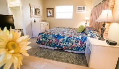 a bedroom with a bed and a television in it at Ocean Inn in Hollywood