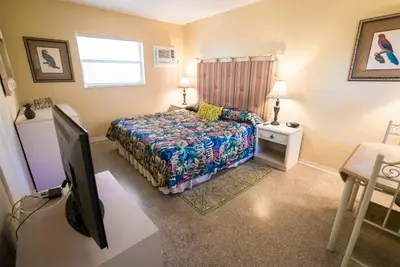a bedroom with a bed and a flat screen tv at Ocean Inn in Hollywood