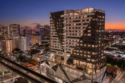 a tall building in a city at night at Element Miami Brickell in Miami