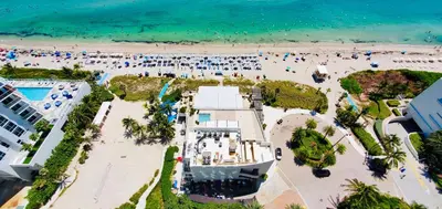 an aerial view of a beach with people in the water at Million Dollar View at Hyde Resort And Residences in Hollywood