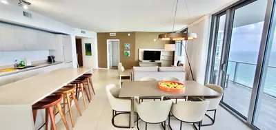 a kitchen and living room with a table and chairs at Million Dollar View at Hyde Resort And Residences in Hollywood