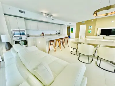 a living room with a white couch and a table at Million Dollar View at Hyde Resort And Residences in Hollywood
