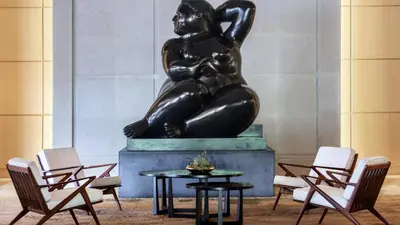 a statue of a woman sitting on top of a table at Live the Miami Experience in an Exclusive Condo 4S in Miami