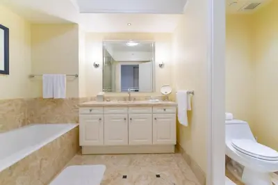 a bathroom with a tub and a toilet and a sink at Live the Miami Experience in an Exclusive Condo 4S in Miami