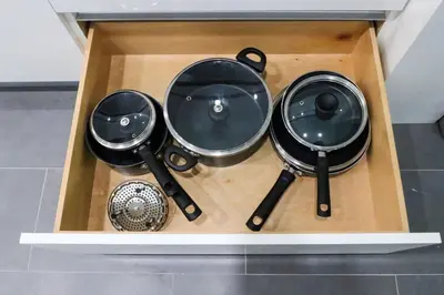 a wooden box with four different pots and pans at Luxury Accommodations Brickell in Miami