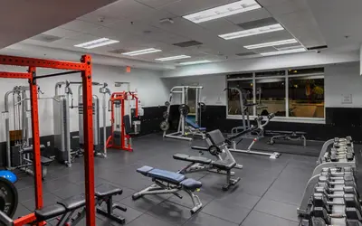 a gym with several treadmills and machines at Luxury Accommodations Brickell in Miami