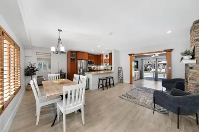 a kitchen and living room with a table and chairs at Home wpool by PMI unit 401 in Fort Lauderdale