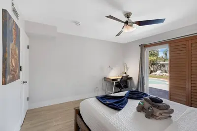 a bedroom with a bed and a ceiling fan at Home wpool by PMI unit 401 in Fort Lauderdale
