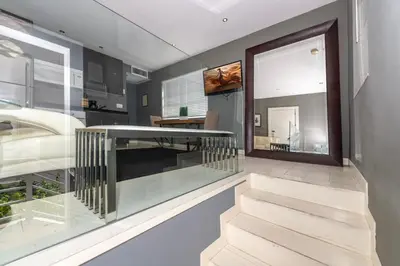 a staircase in a house with a window at Sunny Days Apartments in Miami Beach