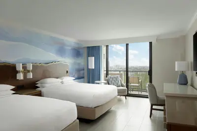a hotel room with two beds and a balcony at Fort Lauderdale Marriott Harbor Beach Resort & Spa in Fort Lauderdale