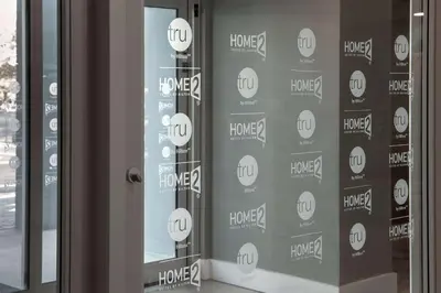 a glass door with a house sign on it at Tru By Hilton Miami Airport South Blue Lagoon, Fl in Miami