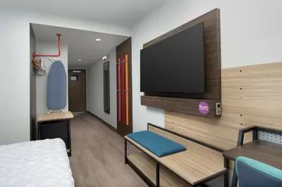 a room with a bed and a flat screen tv at Tru By Hilton Miami Airport South Blue Lagoon, Fl in Miami