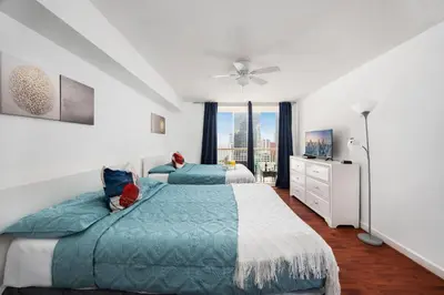 a bedroom with two beds and a window at Two Bedroom Oceanview Apartment in Brickell in Miami